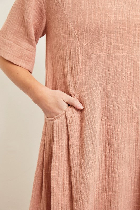 Close-up of textured cotton fabric and side pocket detail.