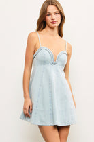 Front view of model wearing light blue braided denim mini dress