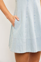 Close up of braided bust and flare hem on denim mini dress