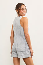 Back view of faded denim playsuit with patch pockets