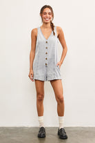Model styling denim romper with loafers and socks