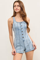 Sleeveless denim jumpsuit with square neckline and vertical seams.